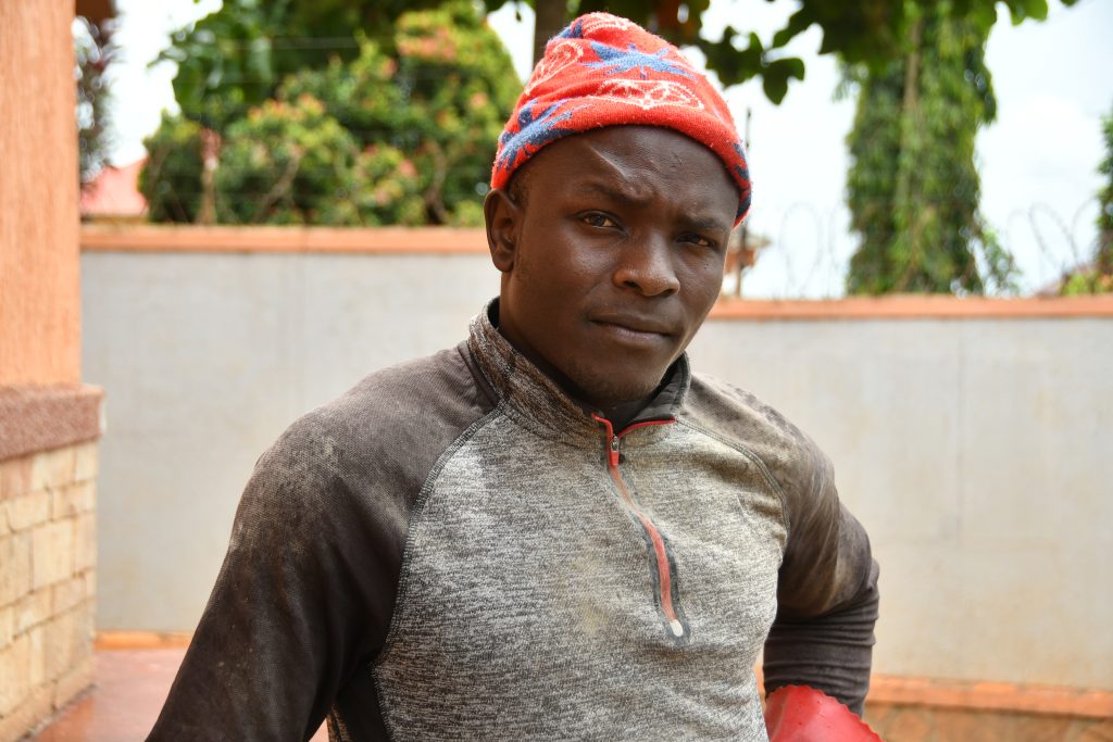 Collins Adiga gateman photographed just outside Kampala. © Edgar Raymond Batte for TWR