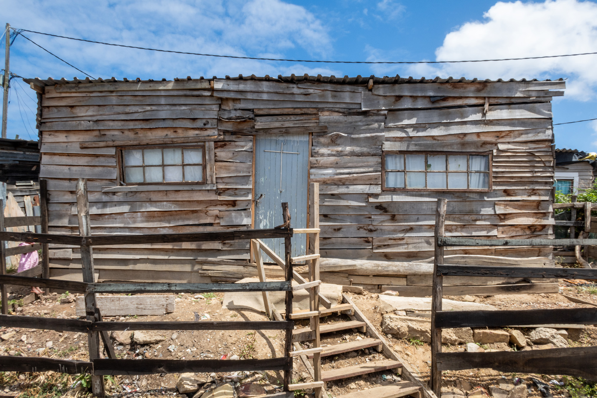 23. Photo of a Corrugated Metal Shack The Weganda Review Issue 13 A shanty house in a South African township, via Wikimedia Commons