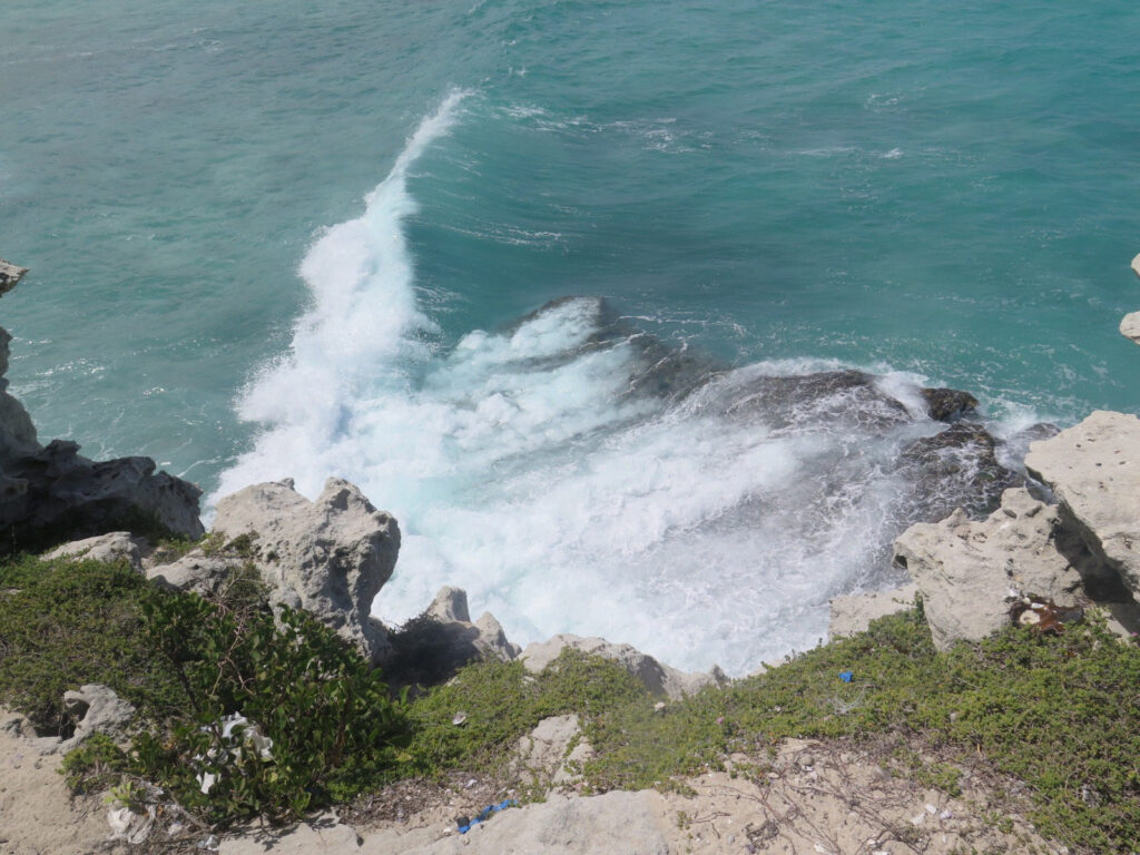 24. Photo of Ocean Waves Crashing on Rocks The Weganda Review Issue 13 Arniston: “View from on top of the cliffs.” Photo by Faswillah Nattabi