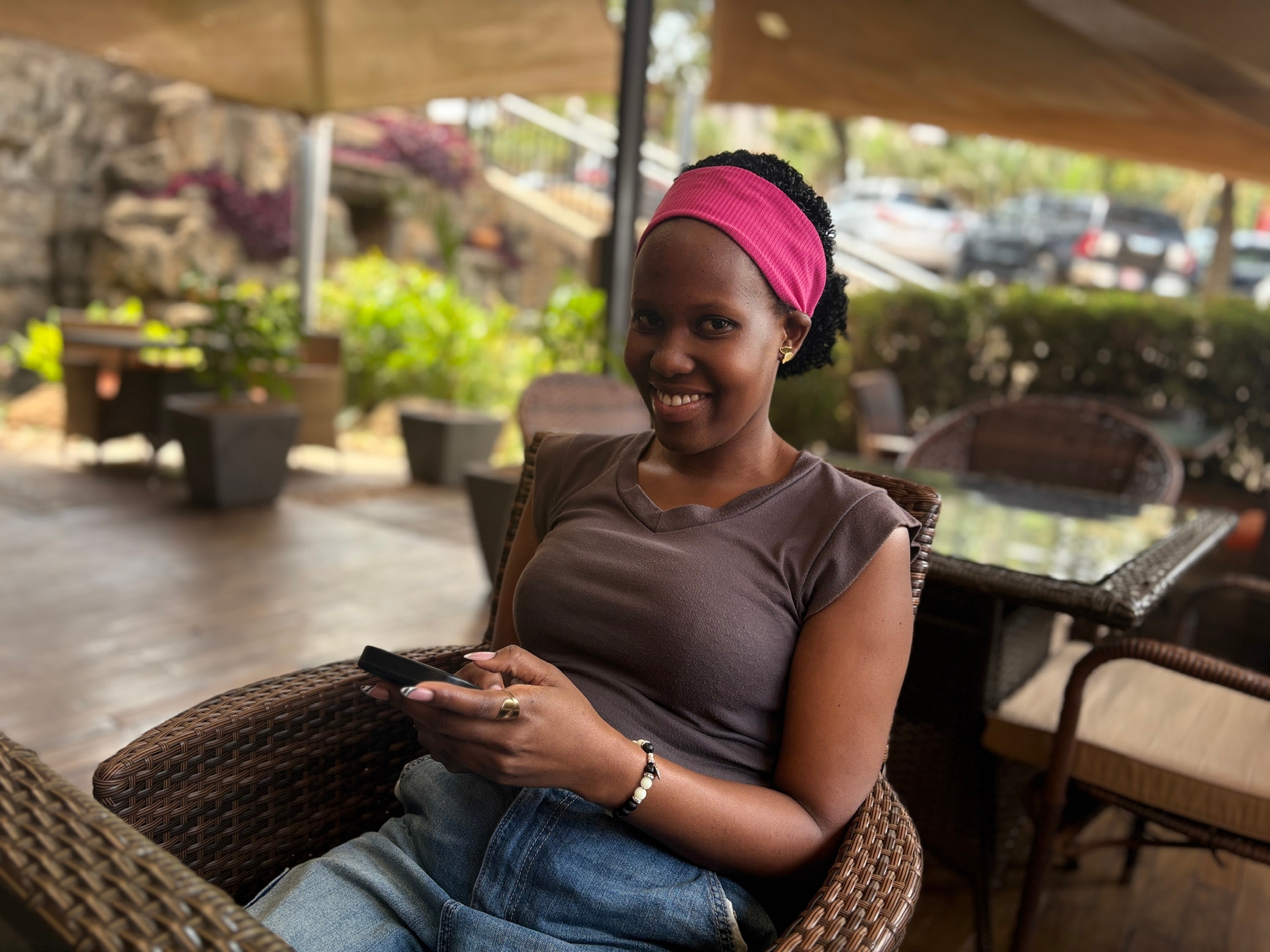 41. Photo of a Smiling Woman Seated at a Cafe Table The Weganda Review Issue 13 41. Photo of a Smiling Woman Seated at a Cafe Table The Weganda Review Issue 13